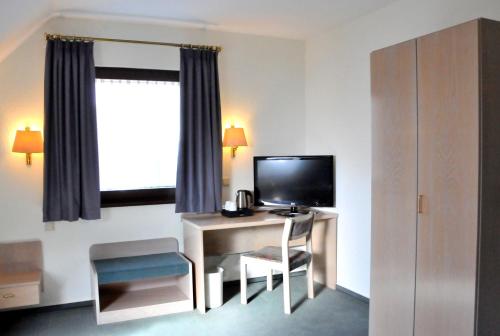Μια τηλεόραση ή/και κέντρο ψυχαγωγίας στο Hotel Garni Haus Dornheim