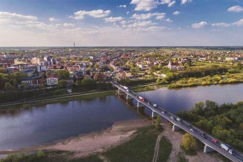 an aerial view of a bridge over a river at Luksusowy loft, z bezpłatnym parkingiem w centrum. in Wyszków