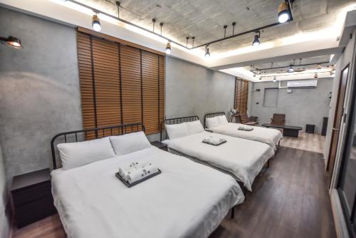 Ένα ή περισσότερα κρεβάτια σε δωμάτιο στο Eryang Homestay
