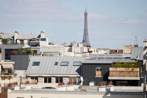a view of a city with the eiffel tower at Le Parchamp, a Tribute Portfolio Hotel, Paris Boulogne in Boulogne-Billancourt