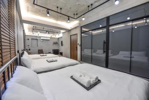 Ένα ή περισσότερα κρεβάτια σε δωμάτιο στο Eryang Homestay