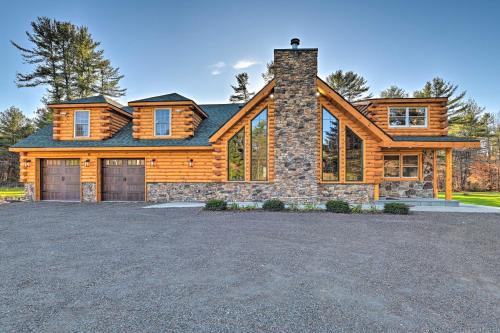 a log home with a large driveway at Unadilla Cabin on 50 Acres and Fire Pit and Creek in Unadilla