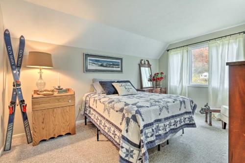 a bedroom with a bed and skis in it at Riverfront Zanesville Getaway with Private Bar! in Dresden