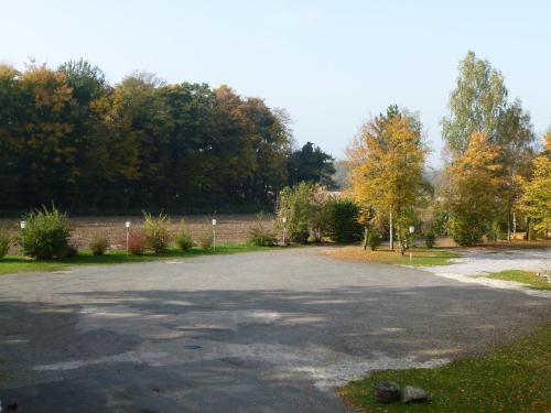 an empty parking lot with trees in the background at Gästehaus Grunewald Bed & Breakfast in Heiden
