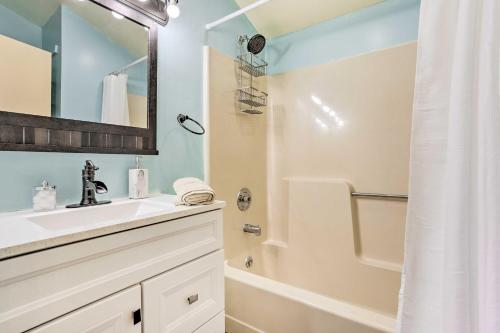 a bathroom with a sink and a shower at Peaceful Poconos Home with Lake and Pool Access! in Long Pond