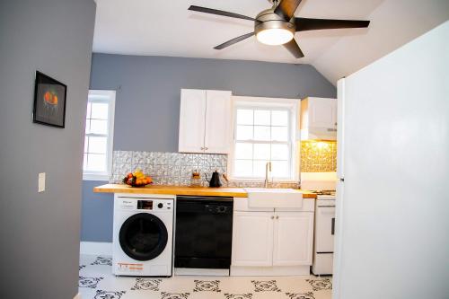 a kitchen with a black and white dishwasher at 521 Smith Steet LLC in Providence