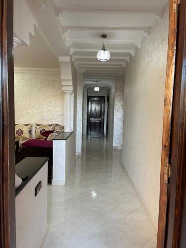 a room with a hallway with a bed and a hallwayngthngthngthngthngth at Villa a tamaris dar bouazza in Casablanca