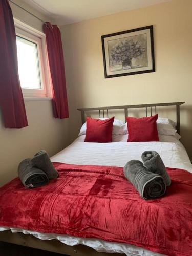 a bedroom with a bed with two towels on it at 1 bedroom townhouse in North Yorkshire in Harrogate