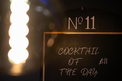 a sign that says no exorcism of the city at No11 Boutique Hotel & Brasserie in Edinburgh