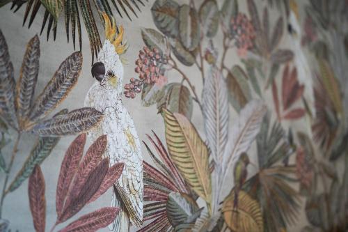 a drawing of a woman on a floral wallpaper at No11 Boutique Hotel & Brasserie in Edinburgh