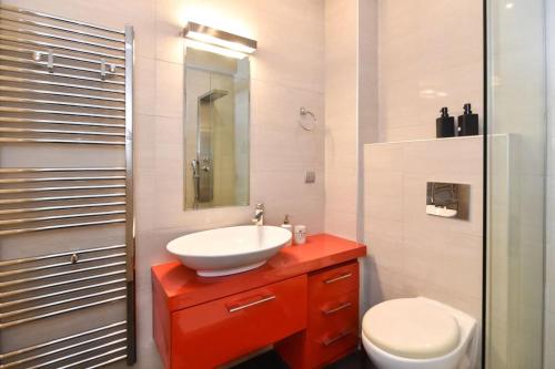 a bathroom with a sink and a toilet at Excellent apartment luxuriously renovated in Larisa