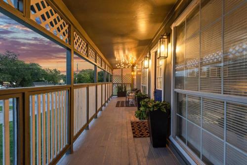 a balcony of a building with a sunset in the background at Sunnyside Retreat in Bacliff