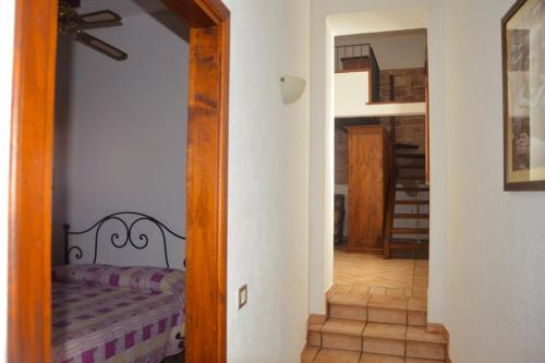a hallway with a couch and a mirror in a room at Residenza San Jacopo in Spello