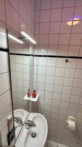 a bathroom with a sink and a mirror at smart&beautiful HOSTEL in Nordkirchen