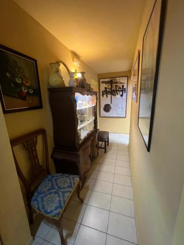 a hallway with a room with a fish tank and a chair at La Ventana in Ibiza Town