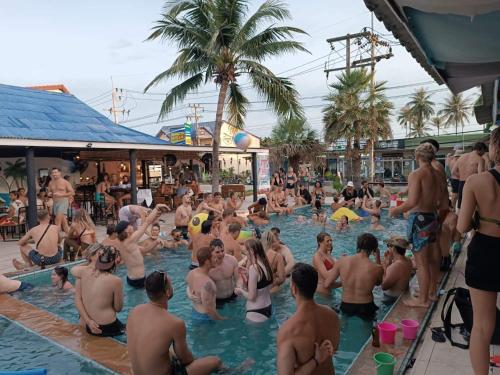 a group of people in a swimming pool at Arena Seaview in Baan Tai