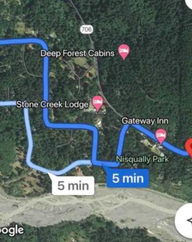 a map of a golf course with locations on it at Cozy Cedar Cabin Steps Away From Mt. Rainier in Ashford