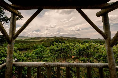 a view from the porch of a tree house at Chalé charmoso e aconchegante, pertinho da cidade. in Brasilia
