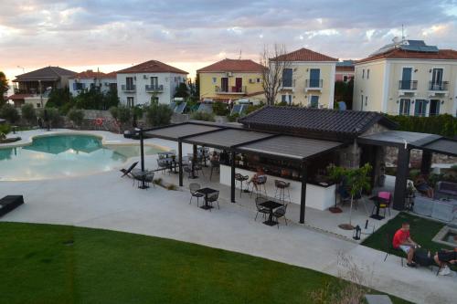 an overhead view of a patio with a pool and buildings at Niki Studios Sea - Front in Petra