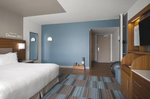 a hotel room with a bed and a bathroom at EVEN Hotel Seattle Downtown - Lake Union by IHG in Seattle