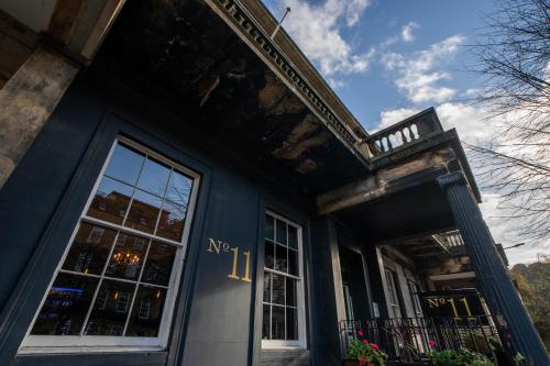 a blue building with a door and a window at No11 Boutique Hotel & Brasserie in Edinburgh