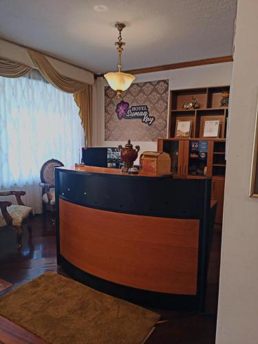 a bar in a living room with at Hotel Sumaq Kay in Cumbayá