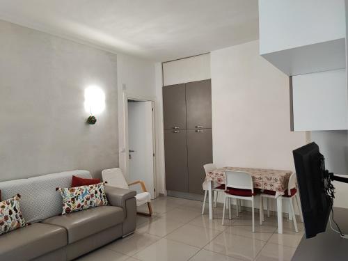 a living room with a couch and a table at da Rosa in Finale Ligure