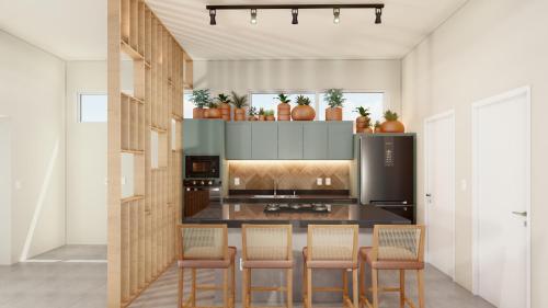 琵琶的住宿－Casa Pipa Flamingos，厨房配有桌椅和炉灶。