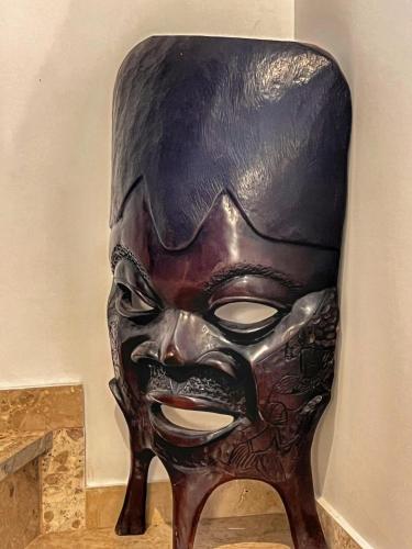a large black mask sitting on top of a table at "Orchomenos" Apartment of Levidi Arcadian Apartments in Levidhion