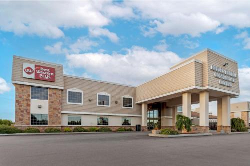 a building with a sign on the front of it at Best Western Plus Dryden Hotel and Conference Centre in Dryden