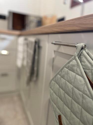 a towel hanging on a counter in a kitchen at Olea White in Skiathos Town