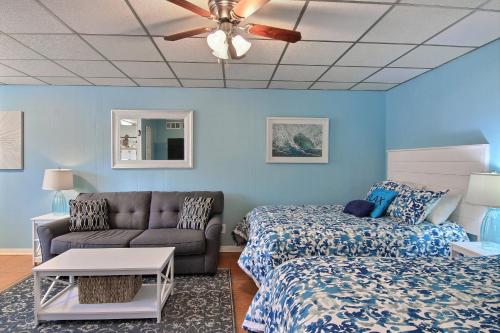 a living room with a couch and a bed at On the Half Shell - Condo in Port Aransas
