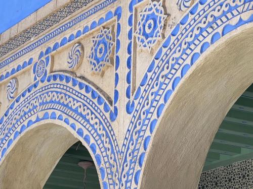 an archway of a building with blue and white tiles at Dar Lekbira Boutique Hôtel in Sousse