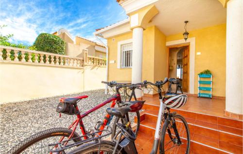 two bikes parked on the front of a house at Amazing Home In Puerto De Mazarrón in Puerto de Mazarrón