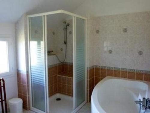 a bathroom with a shower and a tub and a sink at Gîte Chaufour-Notre-Dame, 5 pièces, 9 personnes - FR-1-410-178 in Chaufour-Notre-Dame