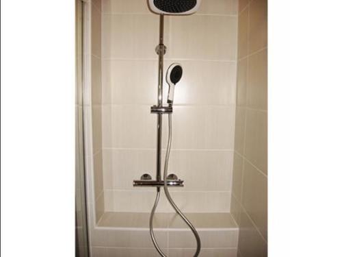 a shower with a shower head in a bathroom at Gîte Le Vernet, 3 pièces, 4 personnes - FR-1-582-318 in Le Vernet