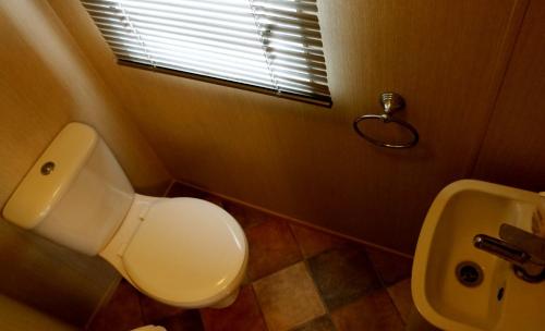 a bathroom with a toilet and a sink at Devon Cliffs Holiday Park - Haven, 3 Bed - ABI Horizon - Wi Fi in Exmouth