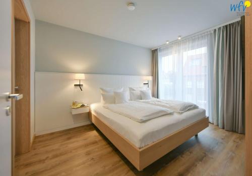 Postel nebo postele na pokoji v ubytování Toewerhus - Wohnung Watt