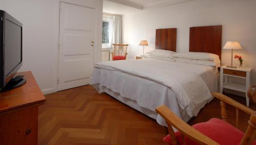 Cama o camas de una habitación en Hotel Tunquelén