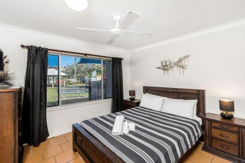 a bedroom with a bed and a window at Apartment 4B in Lennox Head