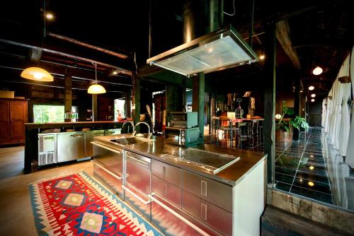 a kitchen with a sink and a counter top at Traditional house, Blue moon villa, 古民家 蒼月庵 in Kimitsu