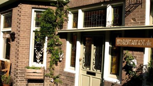 a brick building with a front door of a store at Villa Warempel in Valkenburg