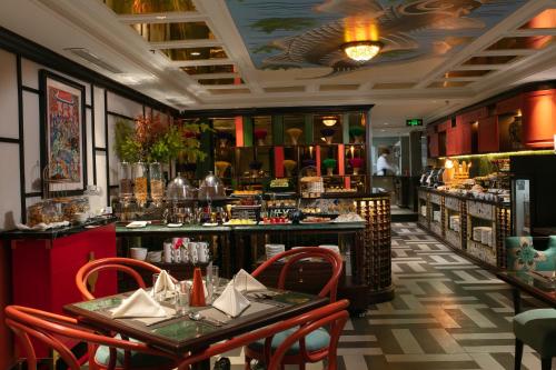 a restaurant with two tables and a bar at HOTEL du LAC Hanoi in Hanoi