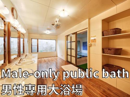 a large bathroom with two sinks and a large mirror at Crown Hotel Okinawa in Okinawa City