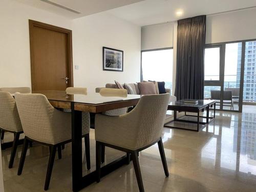 a dining room with a table and chairs and a couch at Altair Colombo - View, Location, Ultra Luxury! in Colombo