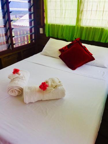 Letto o letti in una camera di Apaula Heights Lounge