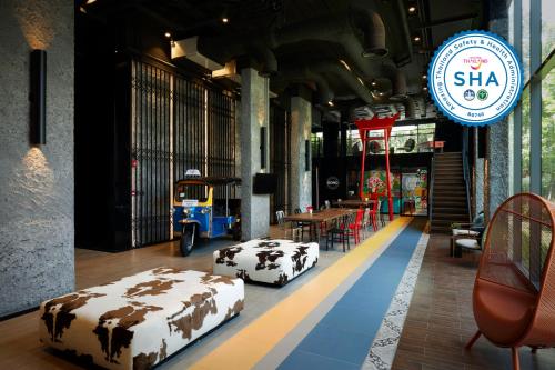 a room with two beds on the floor in a store at lyf Sukhumvit 8 Bangkok in Bangkok