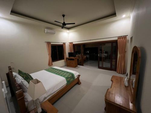 Letto o letti in una camera di Sukun Babonsay Villas