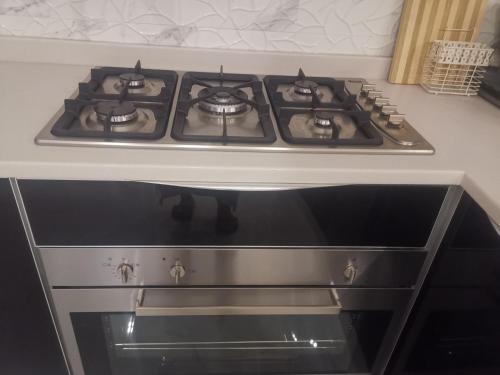 a stove top oven sitting in a kitchen at Highness Villa Nizwa in Nizwa