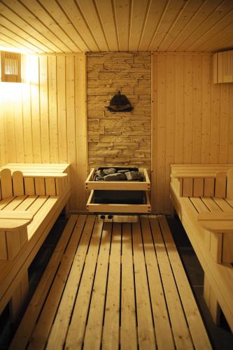 a wooden sauna with two beds in it at St George Ski & Holiday - Half Board & All Inclusive in Bansko